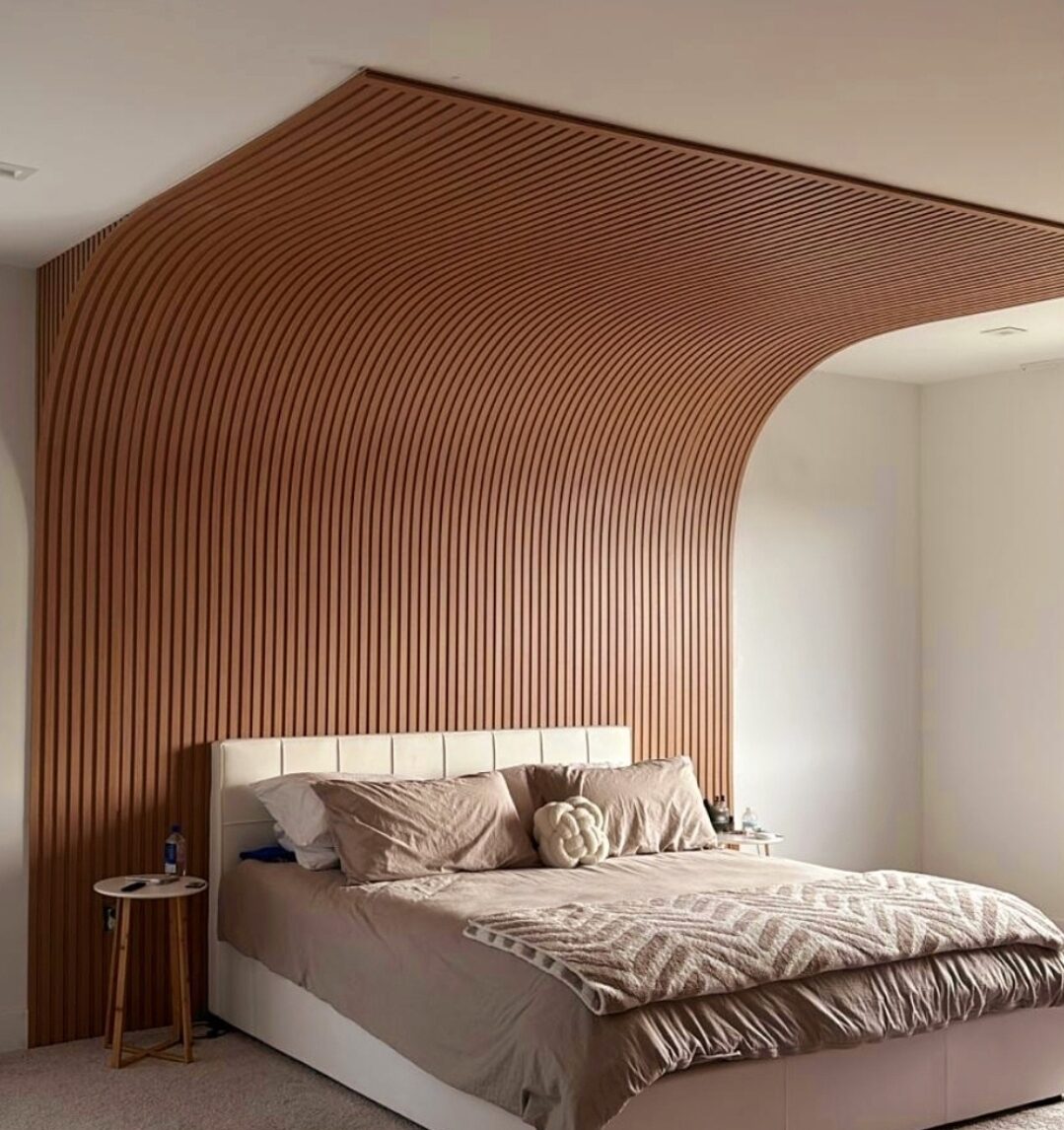 Headboard and curved slatted ceiling