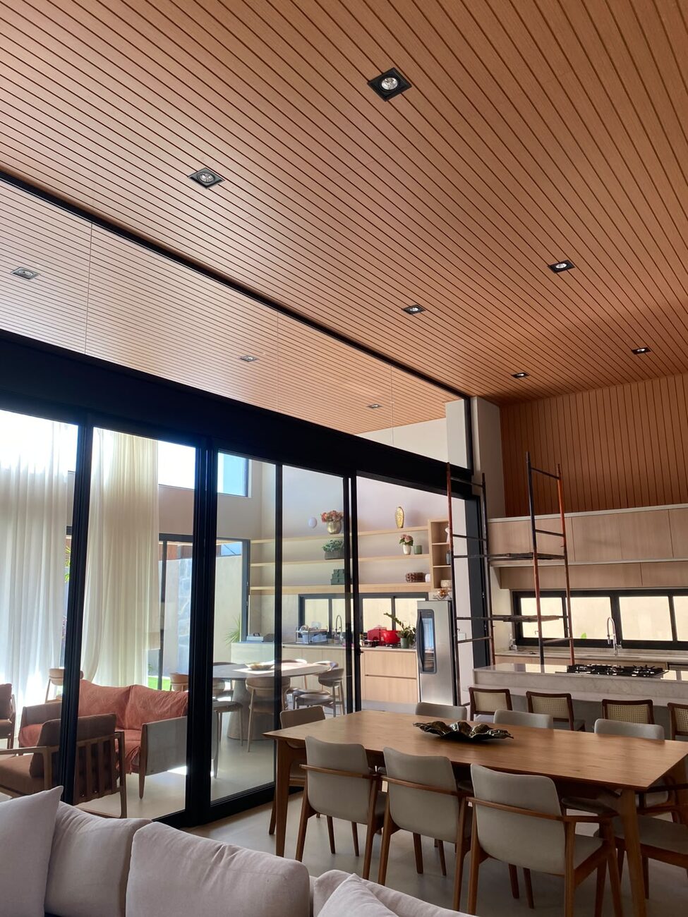 Open-plan living room with paneled ceiling